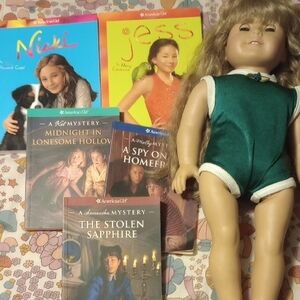 American Girl Doll in Teal Outfit with Books